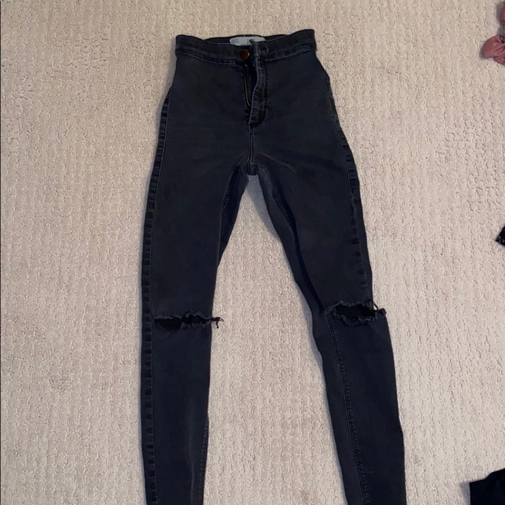 Faded/distressed black skinny jeans
